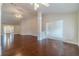Spacious living room with hardwood floors leading to entry and dining areas at 1022 Pecan Grove Pl, Lawrenceville, GA 30046
