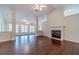 Bright and airy living room with hardwood floors, fireplace, and ceiling fans at 1022 Pecan Grove Pl, Lawrenceville, GA 30046