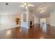 Living room with hardwood floors, fireplace, and view of kitchen and entry at 1022 Pecan Grove Pl, Lawrenceville, GA 30046
