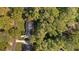 Aerial view of a beautiful brick home with mature trees and landscaping at 1585 Lazy River Ln, Sandy Springs, GA 30350