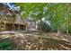 Expansive backyard featuring a patio and lush landscaping, perfect for outdoor enjoyment at 1585 Lazy River Ln, Sandy Springs, GA 30350