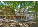 Expansive backyard featuring a patio and lush landscaping, perfect for outdoor enjoyment at 1585 Lazy River Ln, Sandy Springs, GA 30350