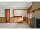 Basement entertainment area with brick fireplace, wet bar and view into a bathroom at 1585 Lazy River Ln, Sandy Springs, GA 30350