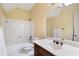 Bathroom featuring vanity, toilet, and bathtub with tiled walls at 1585 Lazy River Ln, Sandy Springs, GA 30350