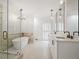 Bright bathroom featuring a glass shower and white cabinets at 1585 Lazy River Ln, Sandy Springs, GA 30350
