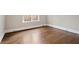 Bedroom with wood floors and natural light from window at 1585 Lazy River Ln, Sandy Springs, GA 30350