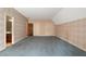Spacious bedroom boasting neutral wallpaper, blue carpeting, and multiple closets at 1585 Lazy River Ln, Sandy Springs, GA 30350