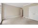 Neutral bedroom with an adjacent doorway and double closet at 1585 Lazy River Ln, Sandy Springs, GA 30350