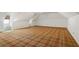 Large bonus room with attic ceilings and carpeted floors at 1585 Lazy River Ln, Sandy Springs, GA 30350