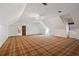 Large bonus room with attic ceilings, closet, and carpeted floors at 1585 Lazy River Ln, Sandy Springs, GA 30350