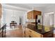 Kitchen with wood island, black granite counters, and stainless steel refrigerator at 1585 Lazy River Ln, Sandy Springs, GA 30350