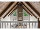 Second-floor view of an open living room with vaulted ceilings and stone fireplace at 1585 Lazy River Ln, Sandy Springs, GA 30350