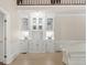 Bright living room featuring custom built-in shelving, hardwood floors, and sophisticated trim work at 1585 Lazy River Ln, Sandy Springs, GA 30350