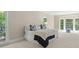 Serene bedroom with large windows, natural light, and plush carpeting at 1585 Lazy River Ln, Sandy Springs, GA 30350