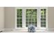 Bay windows with natural light highlight a comfy ottoman at 1585 Lazy River Ln, Sandy Springs, GA 30350