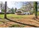 Large backyard with a raised wooden deck, providing ample space for outdoor activities and relaxation at 1598 Kings Rd, Marietta, GA 30062