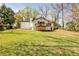 Extensive backyard with a raised wooden deck, ideal for creating an outdoor oasis at 1598 Kings Rd, Marietta, GA 30062