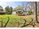 Spacious backyard featuring a well-maintained lawn and a raised wooden deck, great for entertaining at 1598 Kings Rd, Marietta, GA 30062