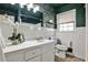 Classic bathroom featuring a single sink vanity, an ornate mirror, and decorative wallpaper at 1598 Kings Rd, Marietta, GA 30062