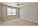 Bright bedroom with large window, neutral walls, and a modern ceiling fan at 1598 Kings Rd, Marietta, GA 30062