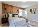 Comfortable bedroom featuring a rustic wood accent wall, soft bedding, and modern decor at 1598 Kings Rd, Marietta, GA 30062