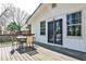 Charming outdoor dining area on the wooden deck, perfect for enjoying the backyard view at 1598 Kings Rd, Marietta, GA 30062