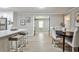 Open-concept dining room and kitchen, showcases bright lighting and plenty of room for entertaining at 1598 Kings Rd, Marietta, GA 30062