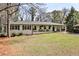 Charming single-story home with a welcoming front porch and well-maintained lawn at 1598 Kings Rd, Marietta, GA 30062