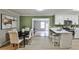 Stylish kitchen with stainless steel appliances, breakfast bar, and view to the living room at 1598 Kings Rd, Marietta, GA 30062