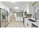 Updated kitchen features stainless steel appliances, a breakfast bar, and open layout at 1598 Kings Rd, Marietta, GA 30062