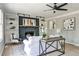 Comfortable living room with a dark fireplace and built-in bookshelves at 1598 Kings Rd, Marietta, GA 30062