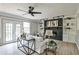 Cozy living room with modern fireplace, built-in bookshelves and french doors to the outdoor patio at 1598 Kings Rd, Marietta, GA 30062