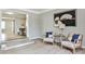 Sitting room showcases tile entryway and transitions into the dining room through the arched doorway at 1598 Kings Rd, Marietta, GA 30062