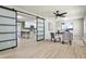 Bright room with modern barn doors, ceiling fan, and desk space, with a view into the kitchen at 1598 Kings Rd, Marietta, GA 30062