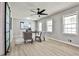 Charming office features lots of natural light and a view of the kitchen through modern barn doors at 1598 Kings Rd, Marietta, GA 30062