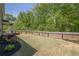 Fenced backyard with a manicured lawn perfect for outdoor enjoyment at 207 Cherokee Reserve Cir, Canton, GA 30115