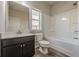 Clean bathroom with a shower-tub combo and ample lighting at 207 Cherokee Reserve Cir, Canton, GA 30115