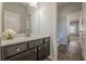 Contemporary bathroom featuring a dark vanity with a white countertop and hardwood style floors at 207 Cherokee Reserve Cir, Canton, GA 30115