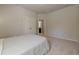 Neutral bedroom featuring a carpet floor and an adjoining bathroom at 207 Cherokee Reserve Cir, Canton, GA 30115