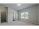 Neutral bedroom featuring a carpet floor, a window, and a bright ceiling light at 207 Cherokee Reserve Cir, Canton, GA 30115