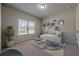 bedroom featuring decor, carpet, and a bright window at 207 Cherokee Reserve Cir, Canton, GA 30115