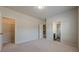 Neutral bedroom with carpet flooring, a ceiling light, closet, and view to bathroom at 207 Cherokee Reserve Cir, Canton, GA 30115