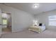 Warm bedroom with neutral walls, plush carpet and a comfortable bed at 207 Cherokee Reserve Cir, Canton, GA 30115