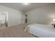 Neutral bedroom with carpet flooring, a ceiling light, closet, and wooden bedside table at 207 Cherokee Reserve Cir, Canton, GA 30115