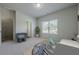 bedroom with stylish decor, a comfortable bed, and natural light at 207 Cherokee Reserve Cir, Canton, GA 30115