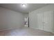 Spacious bedroom featuring neutral carpet and a double-door closet providing ample storage at 207 Cherokee Reserve Cir, Canton, GA 30115