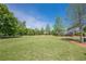 Expansive green lawn area, perfect for outdoor activities and relaxation at 207 Cherokee Reserve Cir, Canton, GA 30115