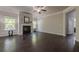 Spacious living room with hardwood floors, fireplace, and natural light from large windows at 207 Cherokee Reserve Cir, Canton, GA 30115