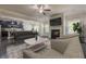 Open living space with a cozy fireplace, TV, and connected kitchen at 207 Cherokee Reserve Cir, Canton, GA 30115