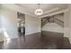 Elegant dining room with hardwood floors, chair railing, and open view of the staircase and modern chandelier at 207 Cherokee Reserve Cir, Canton, GA 30115